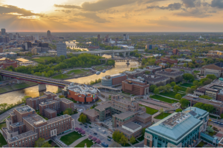 Aerial view of the Twin Cities campus as the sun goes down